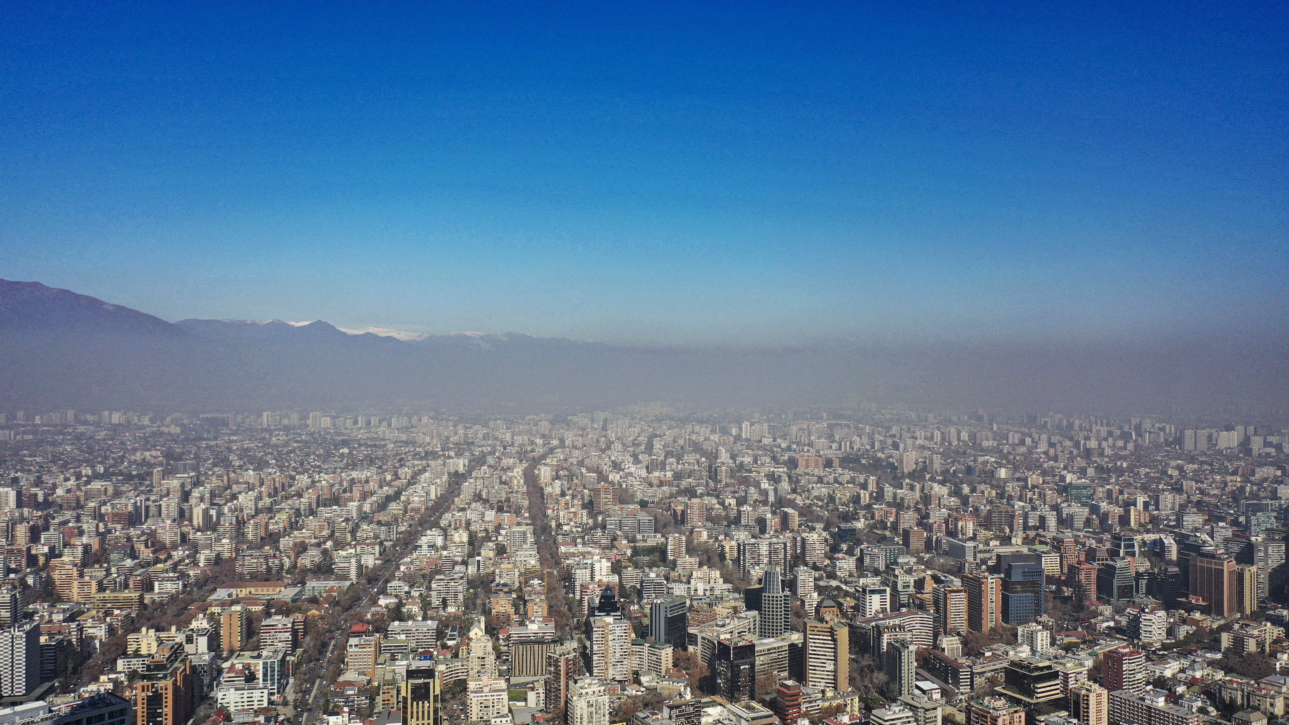 Aerial view of the city of Santiago showing the smog caused by high temperatures, taken on August 2, 2023. South American countries, such as Chile and Argentina, set heat records in the middle of the southern winter due to a combination of the El Niño phenomenon and climate change.