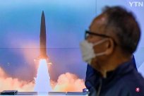 North Korea launches two missiles or protests the US aircraft carrier to participate i